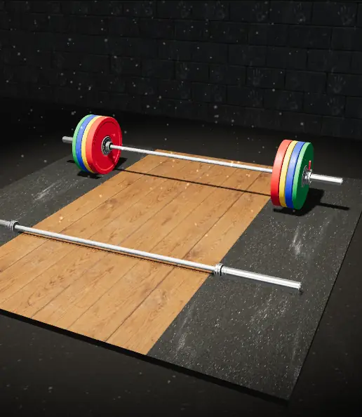 An empty barbell in front and a fully loaded barbell behind it on a lifting platform